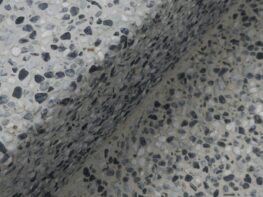 Photo by H&CO Close-up of a speckled terrazzo surface with a shadow