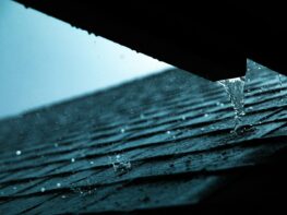 a close up of a rain gutter on a roof